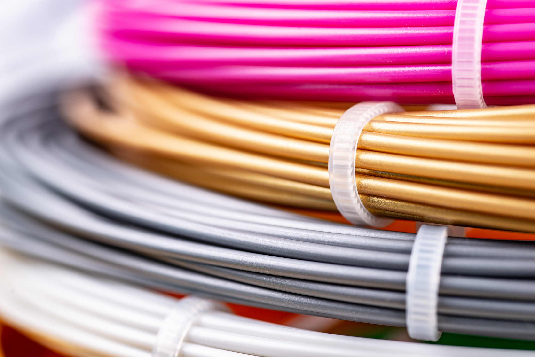 Closeup View of Rolled Wires for Filament Plastic for 3D Printing Pen