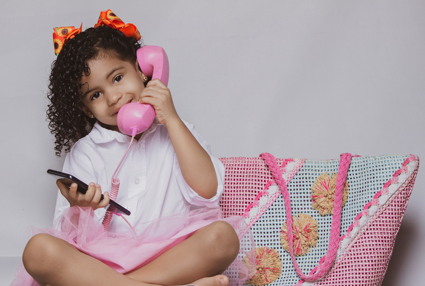 Little Girl Playing with her Toy Telephone 